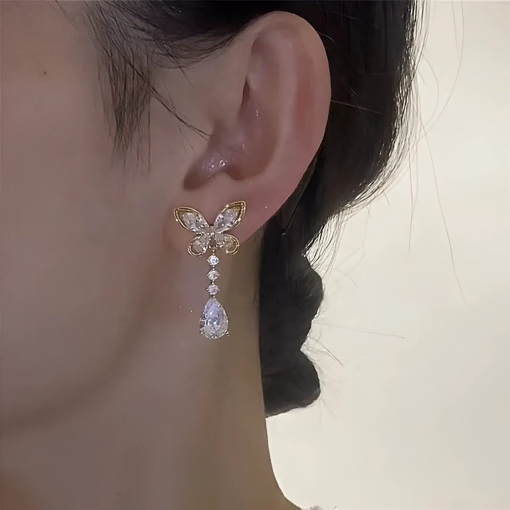 Platinum coloured bow stud earrings with electroplated finish on zinc alloy
