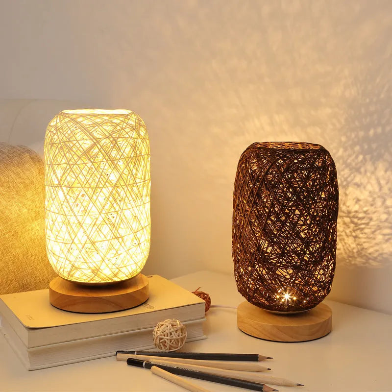 Sepak Takraw ball design desk lamp made of brown hemp rope and wood with a warm LED light.