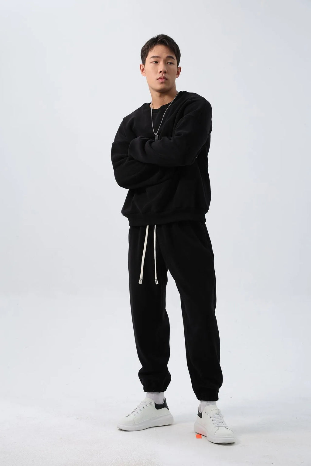 Men's loose fit polar fleece sports suit in army green, showing jacket and trousers.