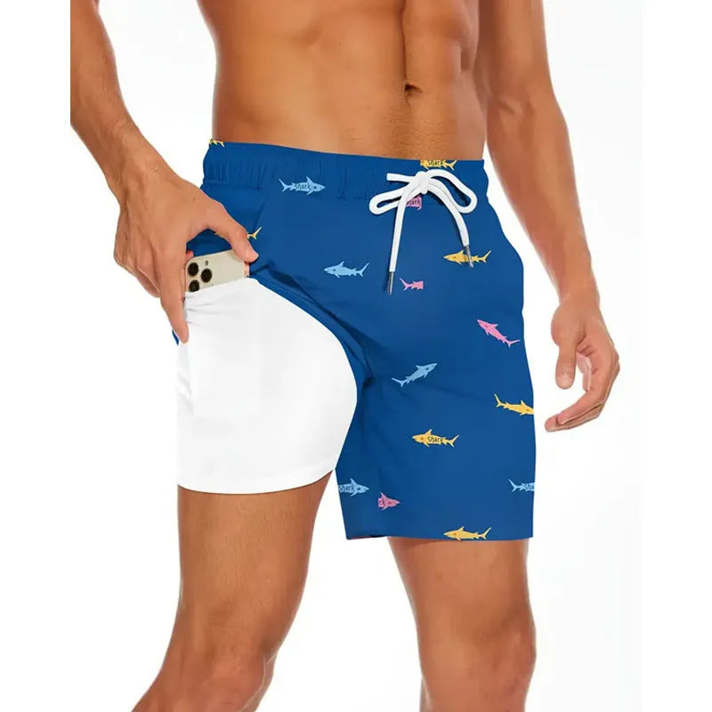Man wearing loose light blue polyester beach pants on shore