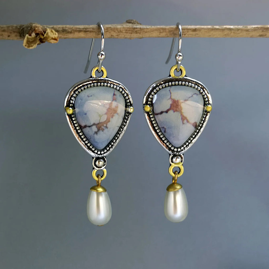 Bohemian geometric drop earrings with synthetic blue opal and white pearls on retro blue electroplated metal