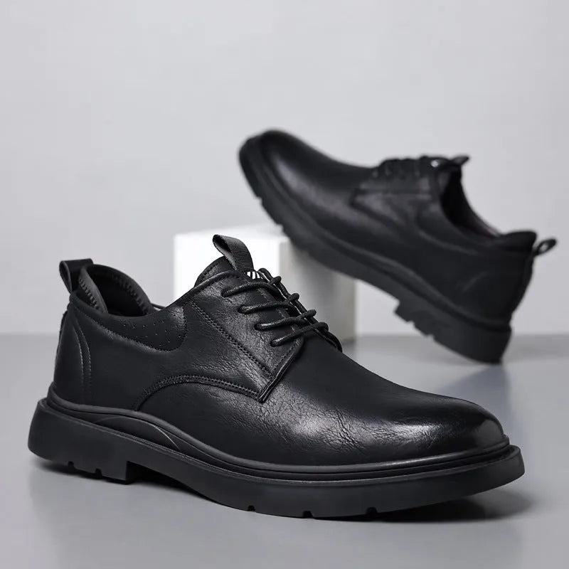 Men's black and brown leather sneaker with sewing line detail on a two-layer cowhide upper and rubber sole.