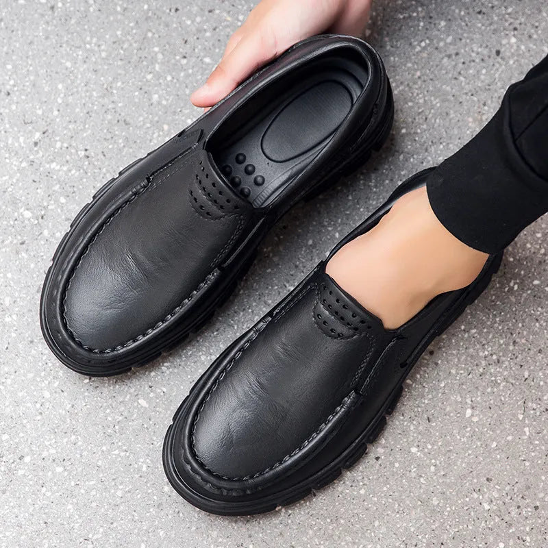 Men's black slip-on work shoes with waterproof platform heel and artificial leather upper