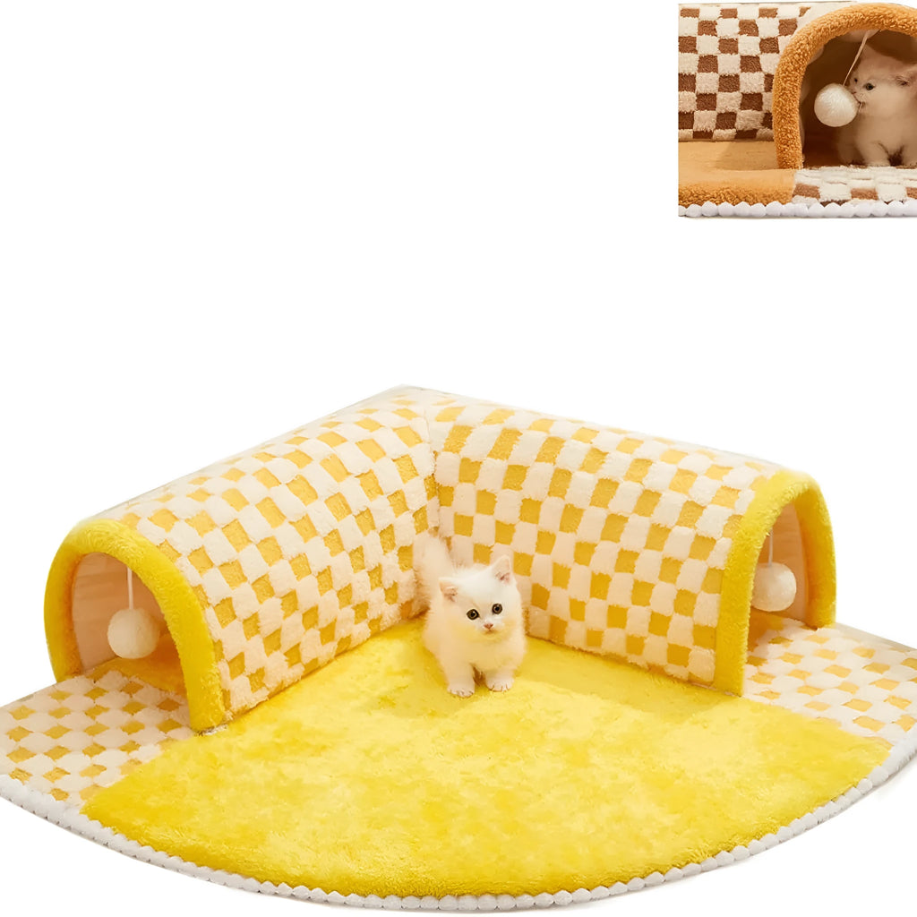 Brown plaid plush cat tunnel bed with a zippered entrance and central mat on a wooden floor.