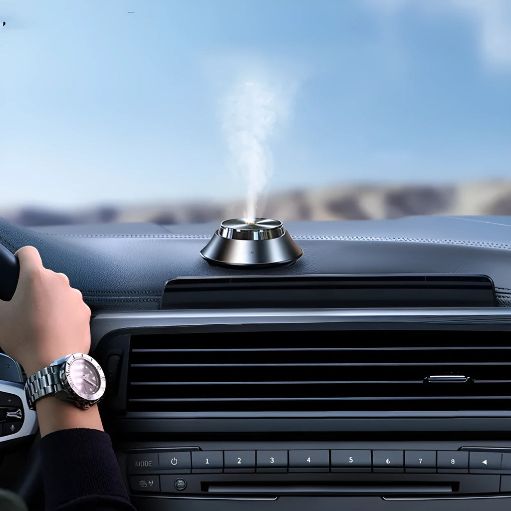 Black metal car aromatherapy device with butterfly design and USB cable connection