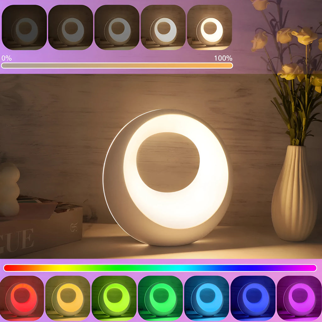 Creative Touch small white RGB colour-changing desk lamp with remote control on a wooden table.