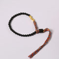 Hand-woven obsidian bead bracelet strap on a wrist, showing its 4mm width and dark colour.