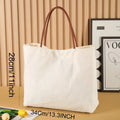 Heavy-duty cotton canvas tote bag with internal pockets, shown in beige white colour.