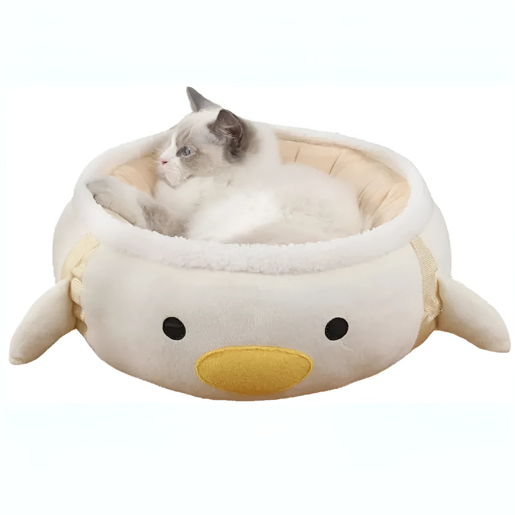Green dinosaur-shaped cat bed shown both flat as a sofa and hanging as a hammock with straps
