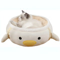 Green dinosaur-shaped cat bed shown both flat as a sofa and hanging as a hammock with straps