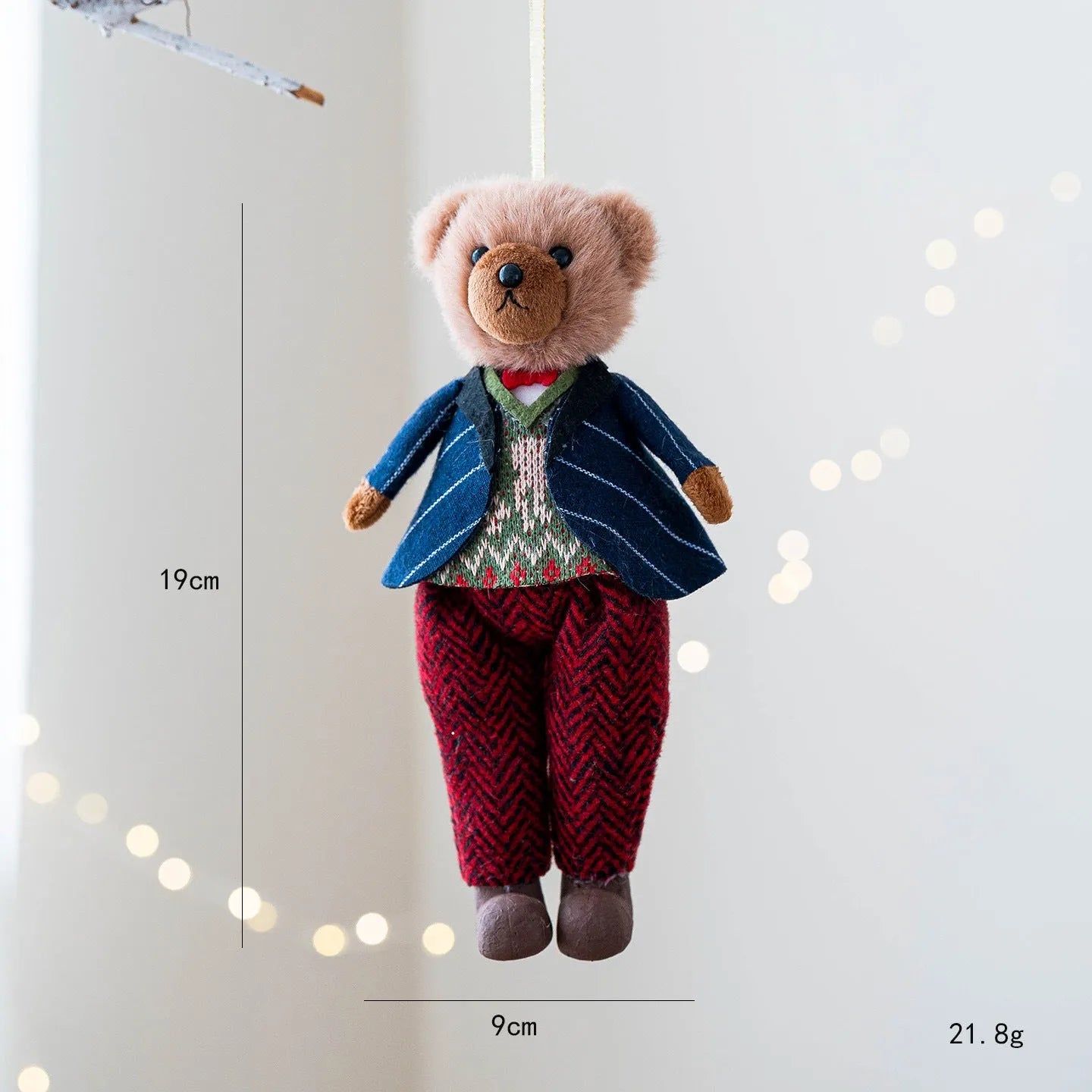 Cartoon plush bear doll wearing a cotton suit with a plaid print, in two colour options.