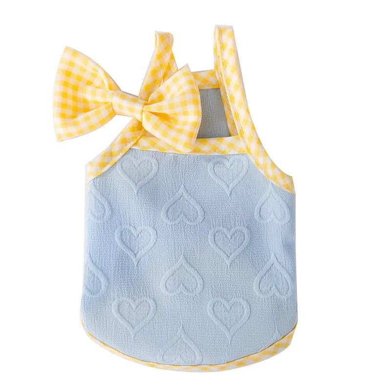Small dog wearing elastic vest with heart texture and bow suspenders in Bondi Blue colour