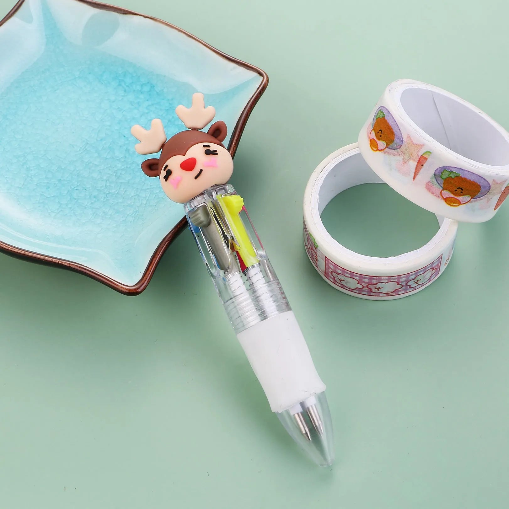Christmas mini four-colour press-action ballpoint pen with festive designs measuring 11 cm.