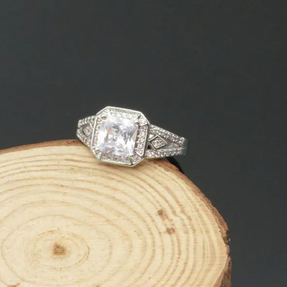 Geometric hollow women's ring with zircon stones in platinum colour