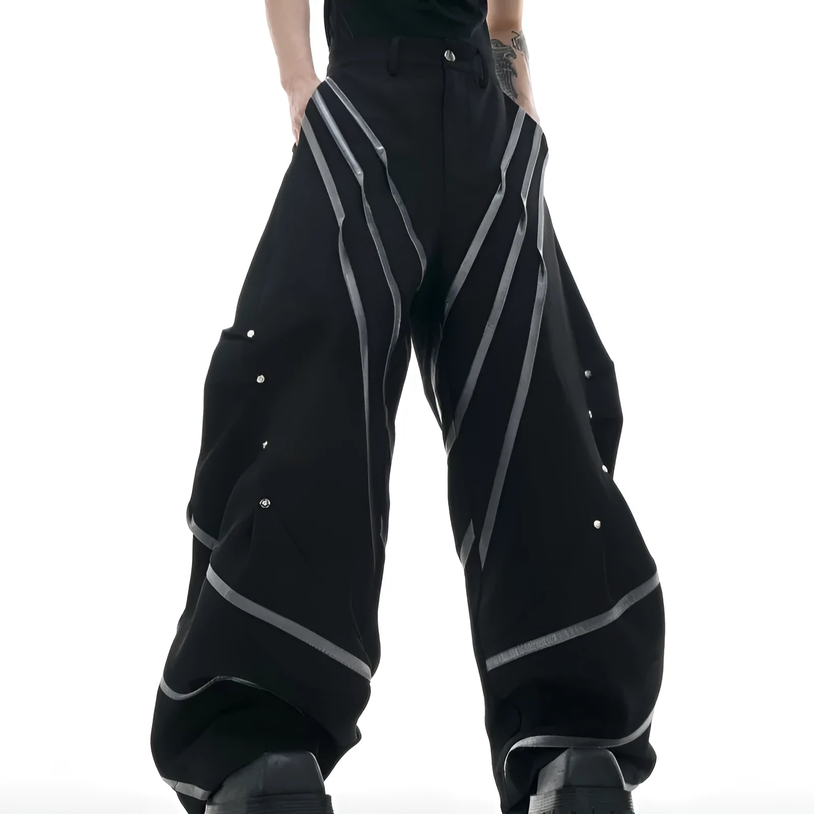 Men's grey polyester trousers with metal rivet stripes, front pleats, and a 3D cut, shown in sizes S to XL.