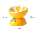 Ceramic raised cat bowl in orange with tilted design for food and water