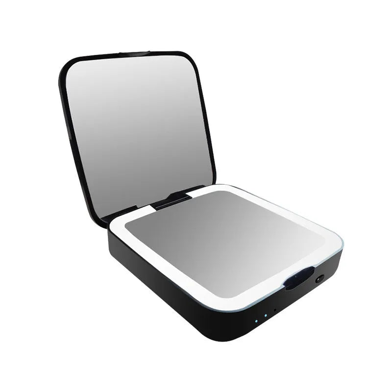 Black and white lighted makeup mirror showing 4x magnifying section and adjustable warm and cool lights.