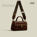 Women's retro brown messenger bag with square design showing sewing thread detailing and outer sandwich pocket