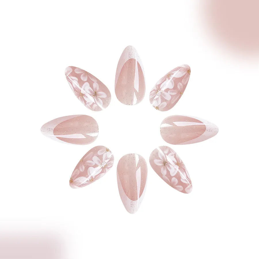 Short glossy almond false nails with French style and glitter powder flower design