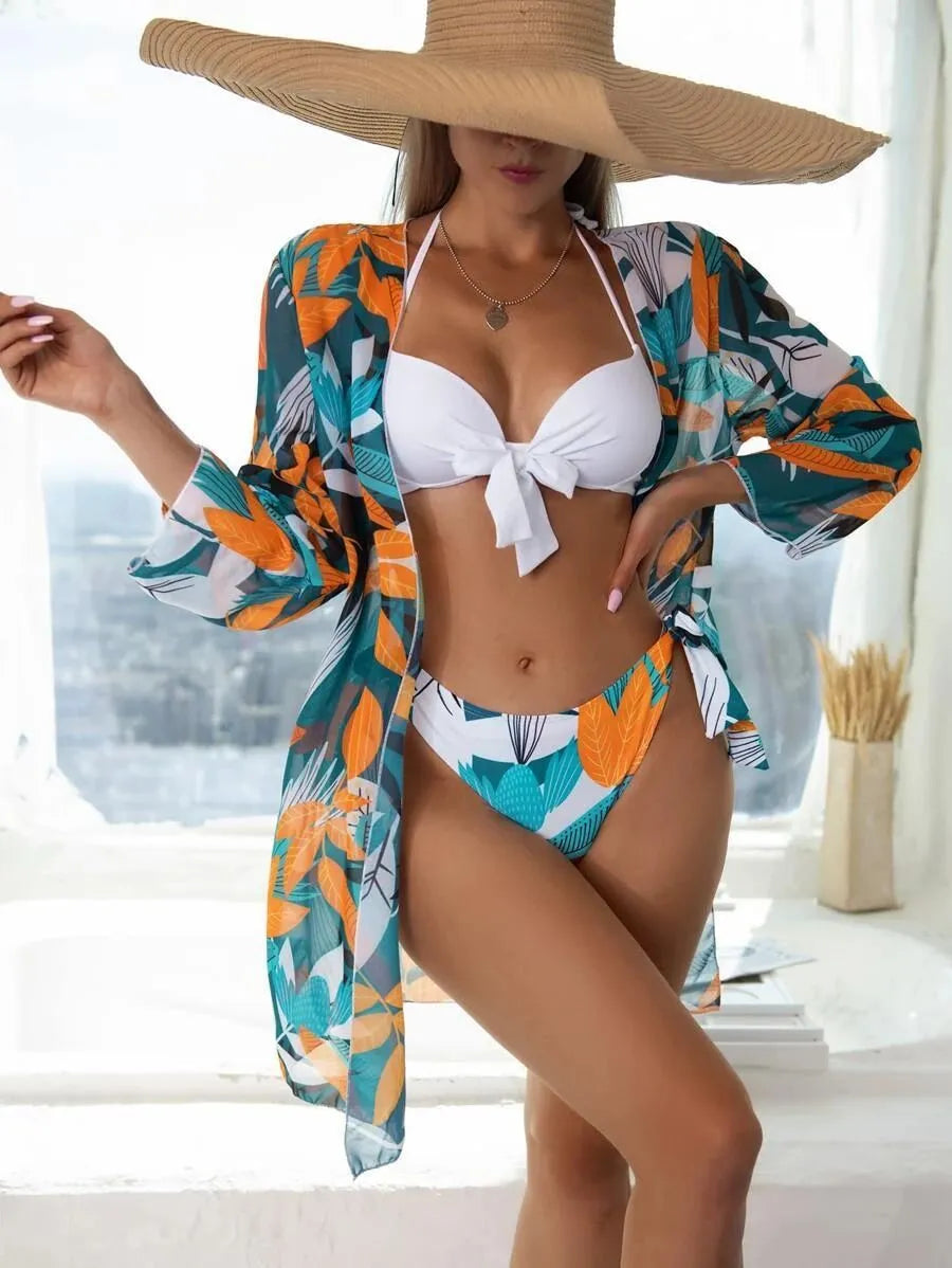 Women's three-piece polyester bikini swimsuit set with mesh detailing and a matching coat.