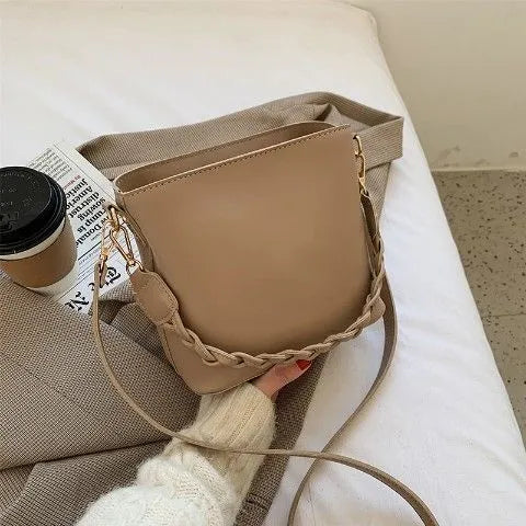 Retro style woven PU crossbody bucket bag in neutral colour