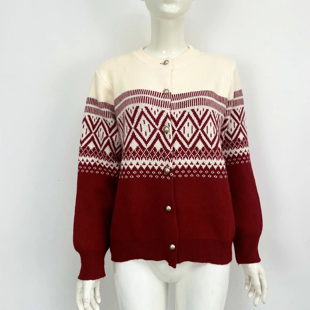 Women's grey alpaca wool cardigan with a red and white diamond knit pattern and long sleeves.