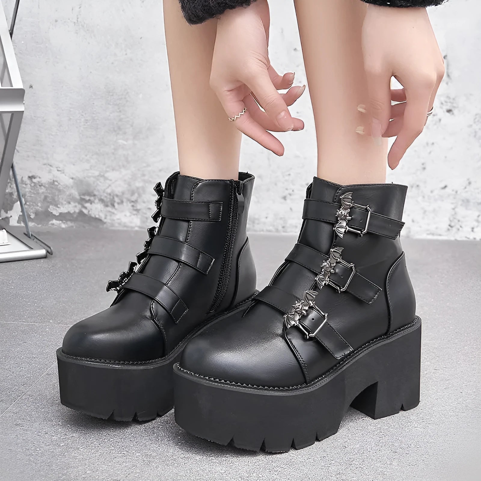 Women's black Harajuku punk ankle boots with bat buckle, side zip, and thick heel.