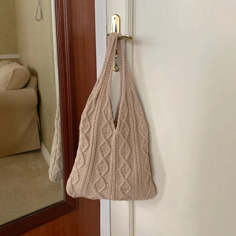 Women's retro style hollow knitted polyester tote bag in a solid colour, showing large open top and textured yarn material.
