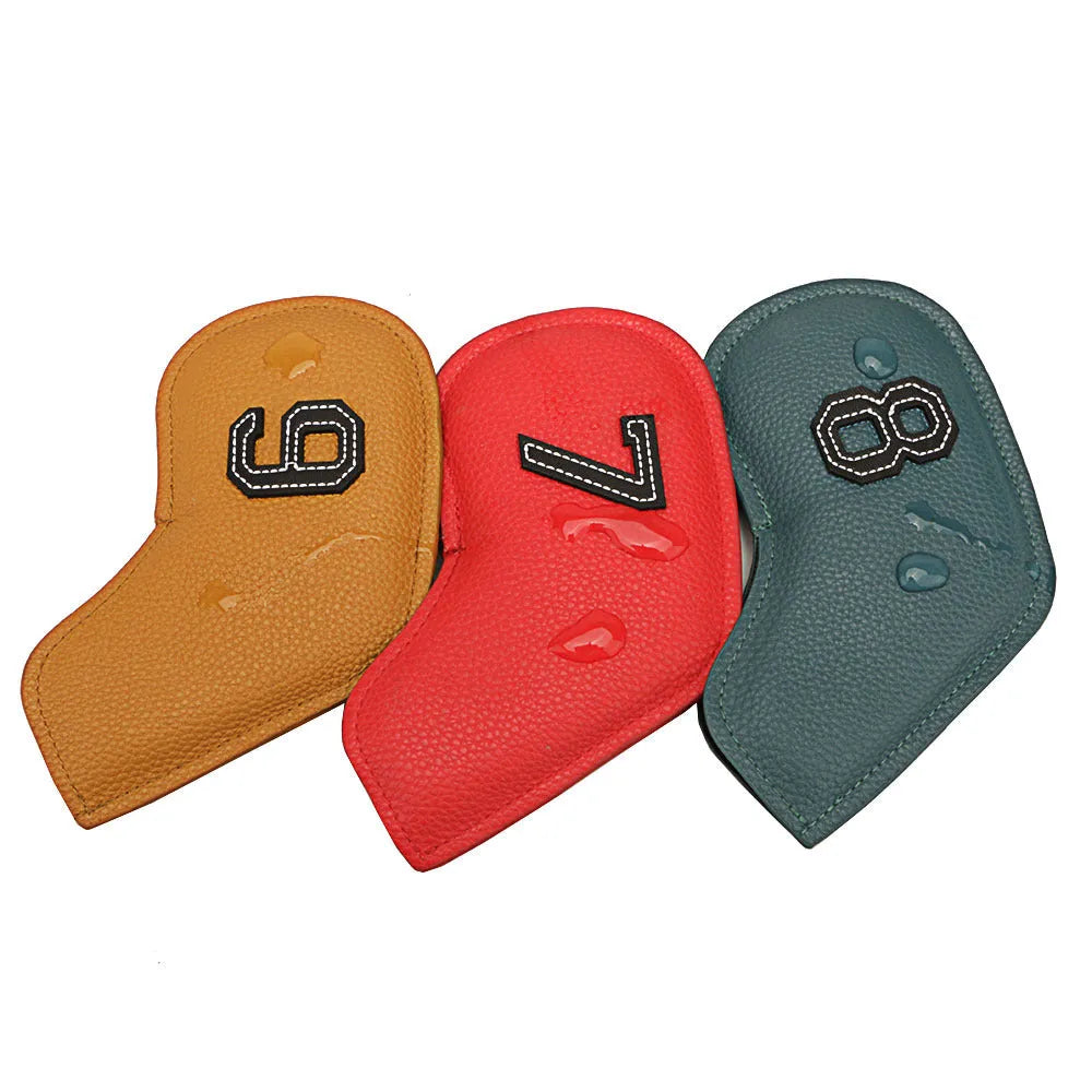 Set of 10 assorted digitally printed PU golf club head covers on a golf bag.