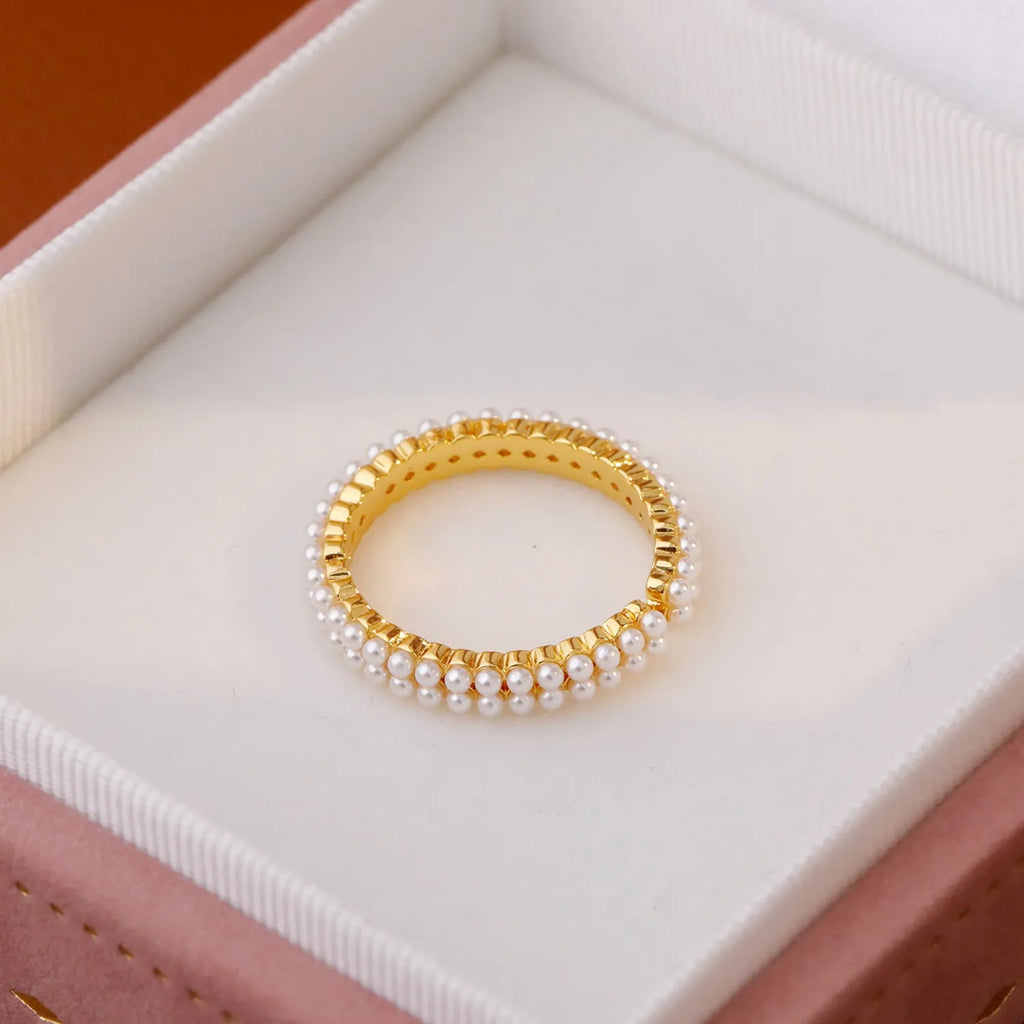 Gold geometric open mouth women's ring with round pearl-like elements on copper base