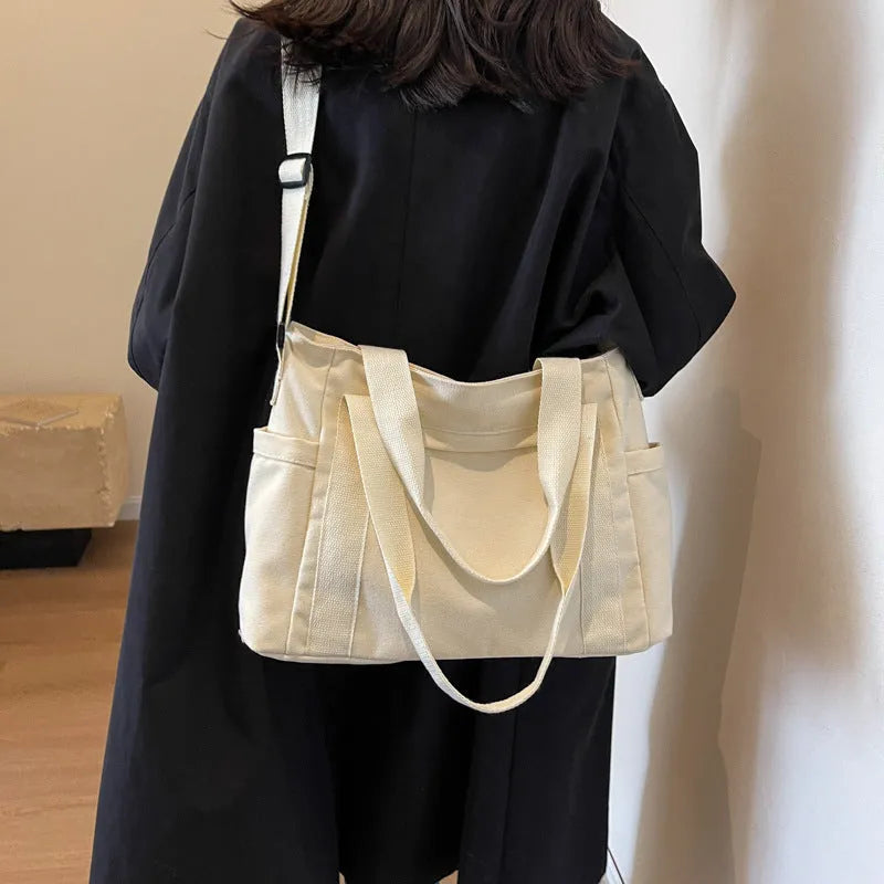 Polyester shoulder bag for women with phone compartment and sandwich pockets in solid colour options