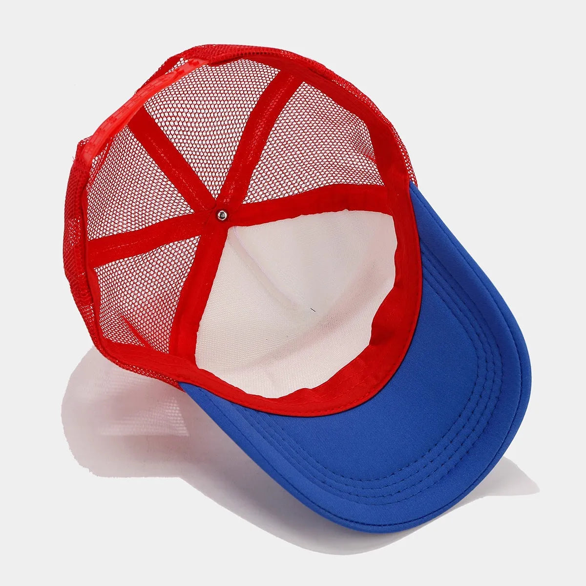 Red and blue contrast mesh adjustable baseball cap on a solid background