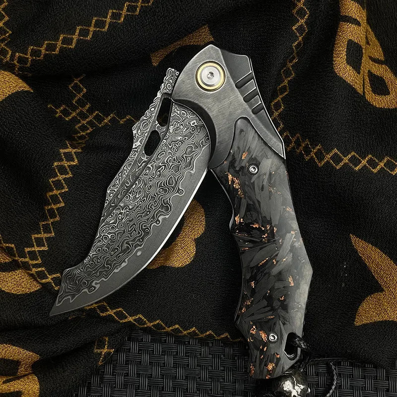 Damascus steel folding knife with carbon fibre handle and 9cm VG10 blade open on wood surface