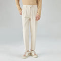 Men's beige straight-leg corduroy trousers with a loose fit and mid-waist design