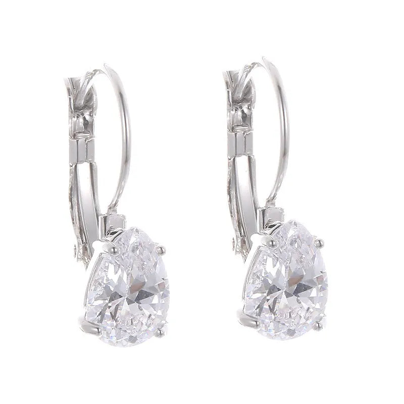 Drop-shaped women's metal earrings with gemstones in gold or platinum colour.