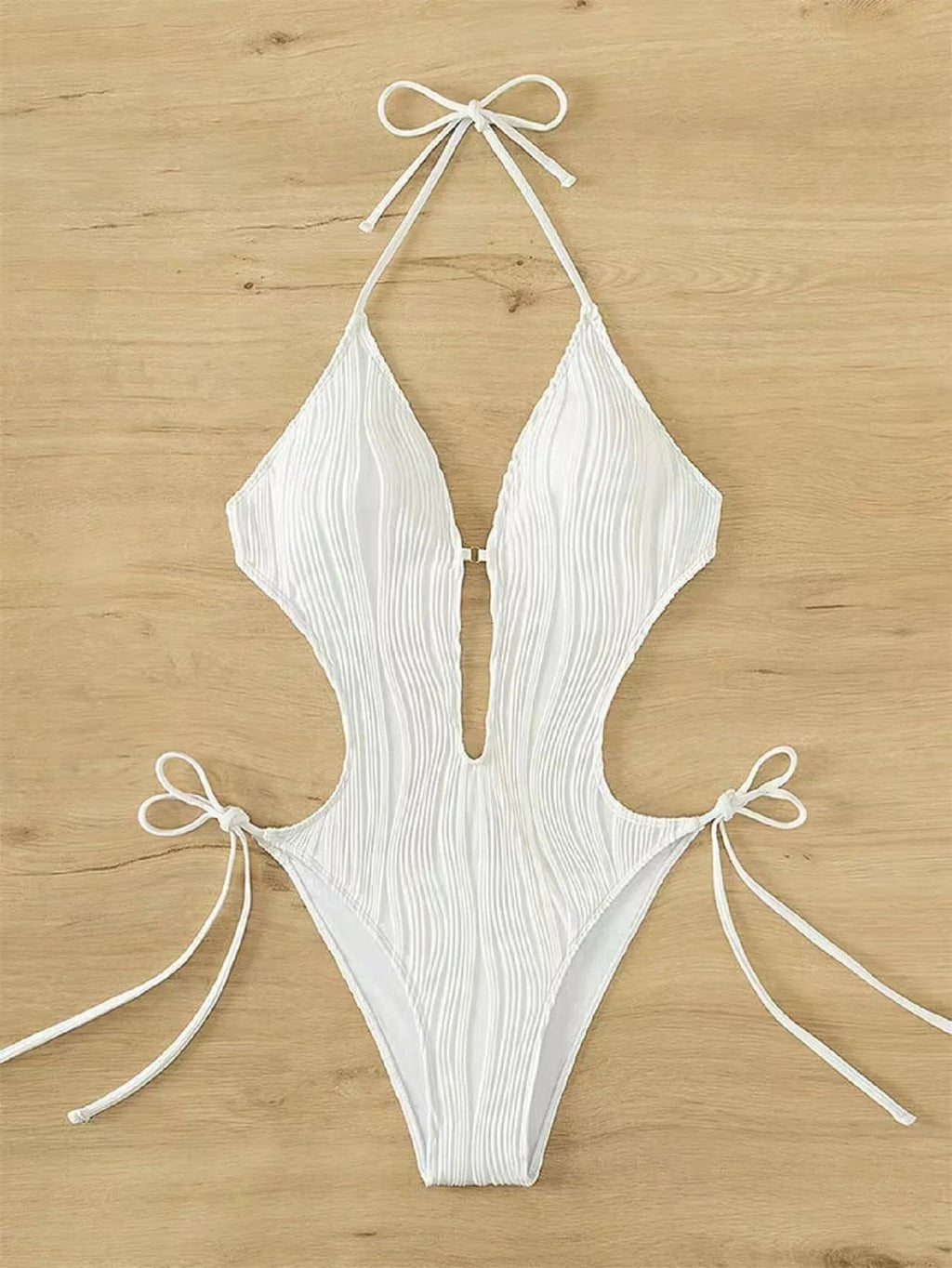 Women's black triangle bikini swimsuit with lace-up front closure on mannequin