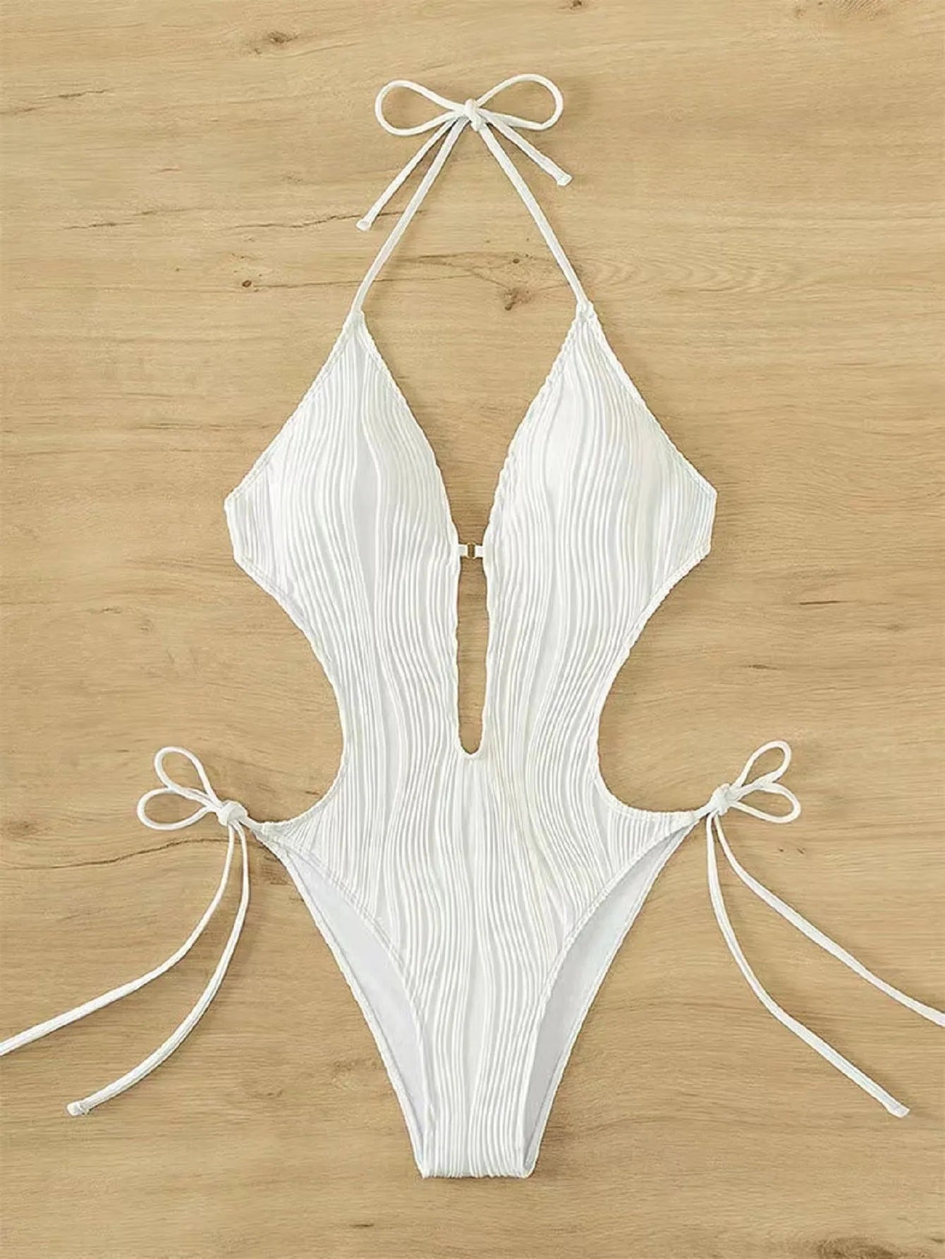 Women's black triangle bikini swimsuit with lace-up front closure on mannequin
