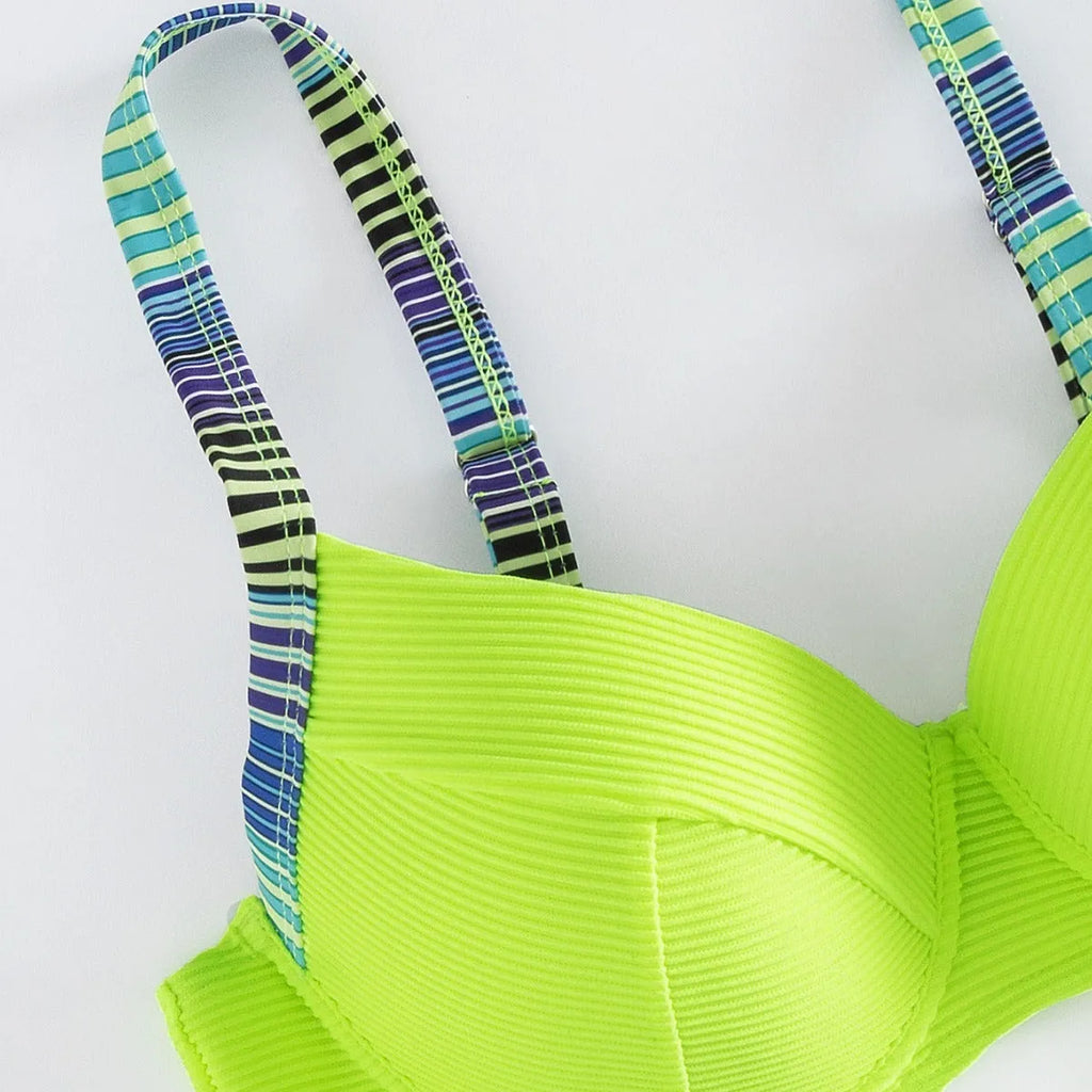 Green printed women's halter bikini set with split briefs on white background