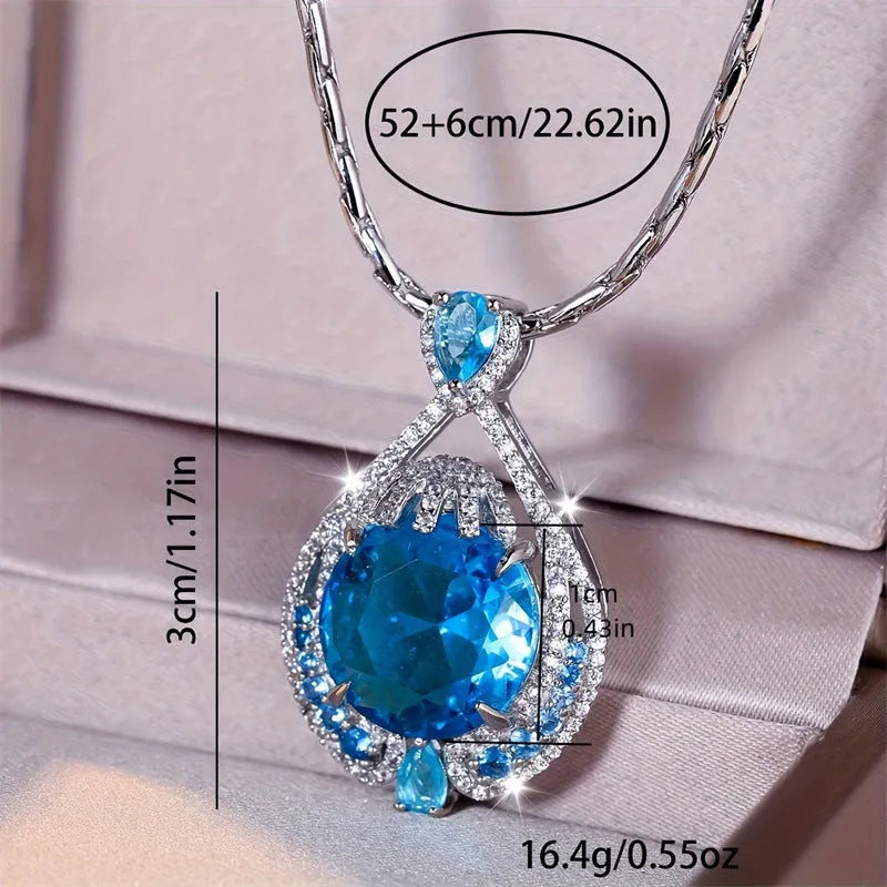 Women's bright blue crystal necklace with geometric fireworks-cut pendant on water wave chain