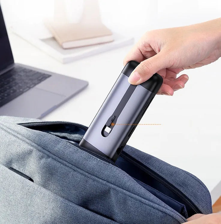 USB C docking station showing ports for HDMI, USB 3.0, PD charging, VGA, Ethernet, and card reader.