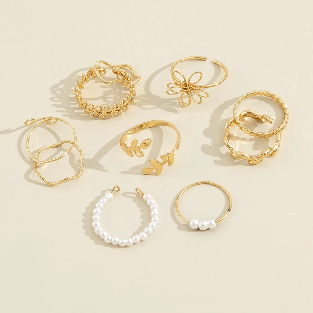 Women's alloy openwork flower ring with glossy electroplated gold finish