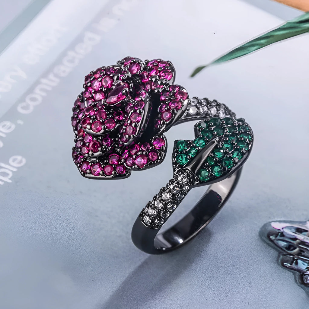 Black gold geometric flower ring with simulated red corundum centrepiece on copper base