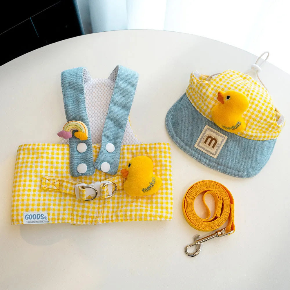Dog wearing harness and leash with wire rope, cat clothes outfit with hat, three-piece pet set