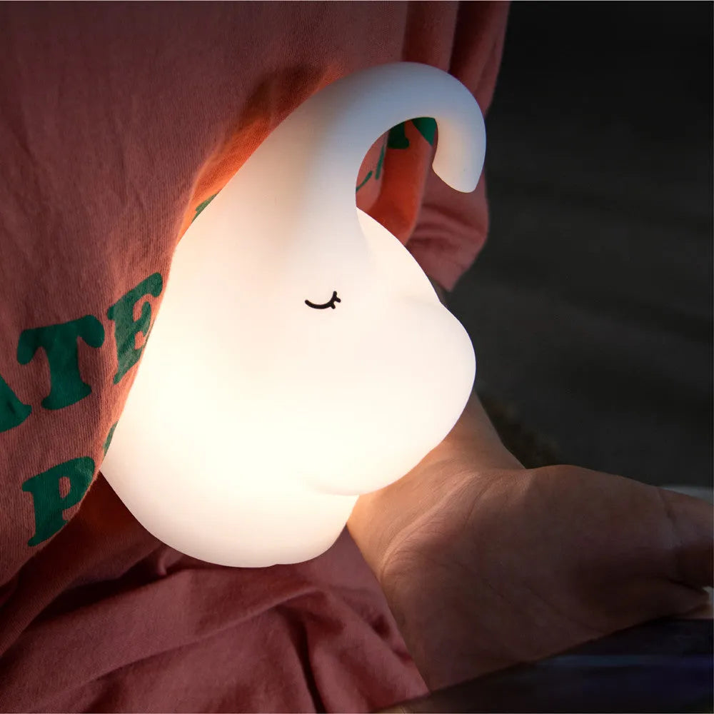 Elephant-shaped silicone night light with warm white LED illumination measuring 96mm wide by 151mm high