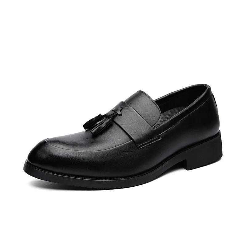 Men's black slip-on business casual shoes with a tassel detail and pointed toe.