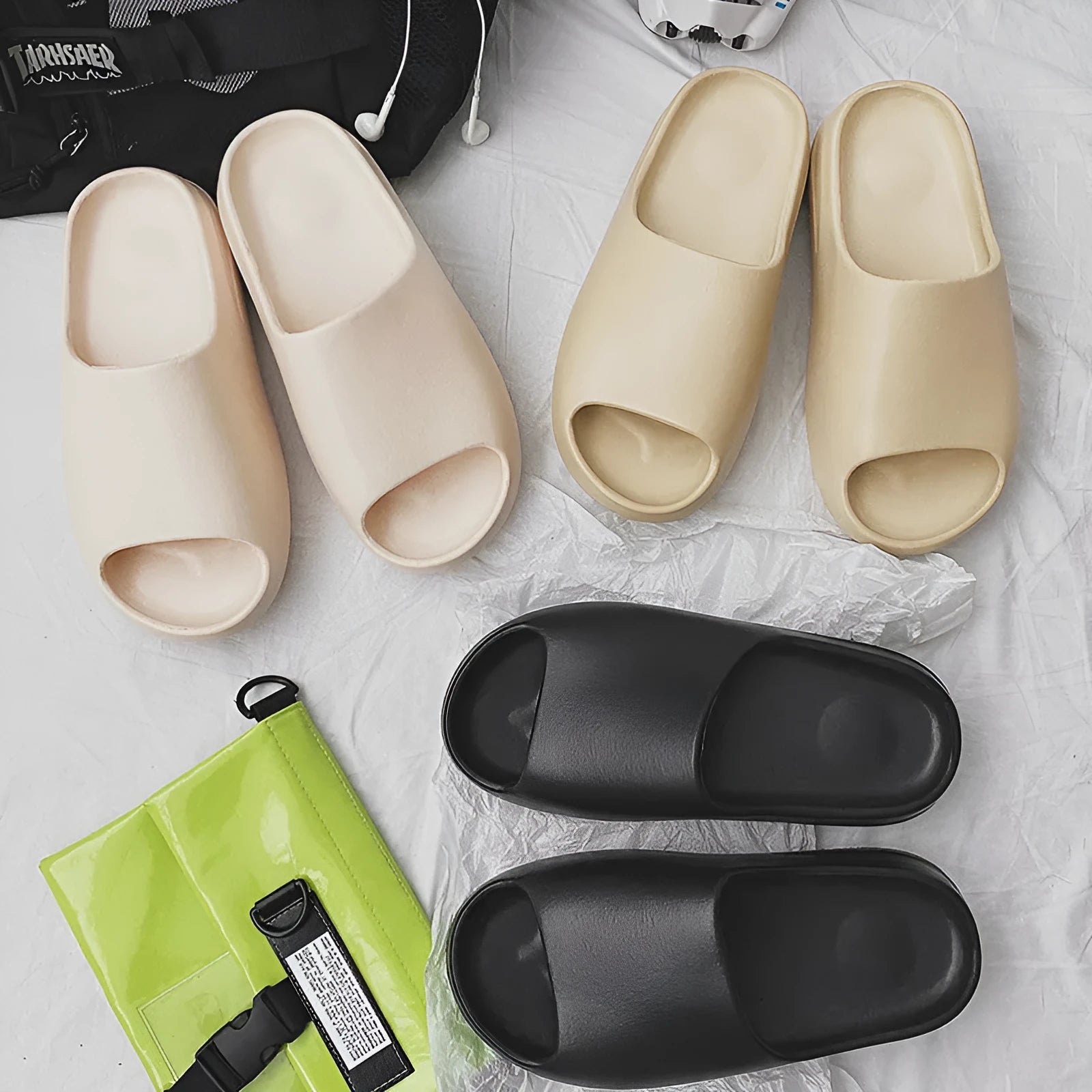 Women's thick sole beach slippers in black, green and brown colours with EVA injection moulded construction
