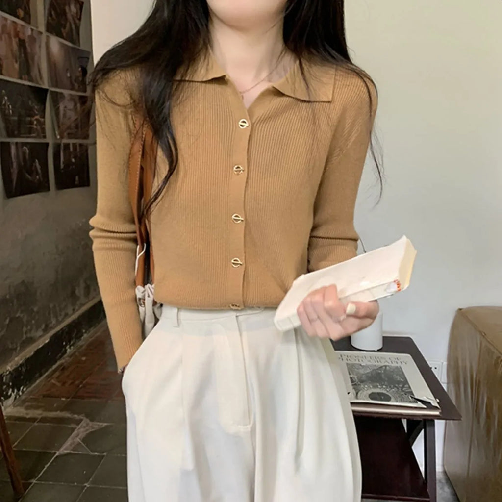 Loose-fitting knitted cardigan in viscose fibre showing long sleeves and neutral colour options