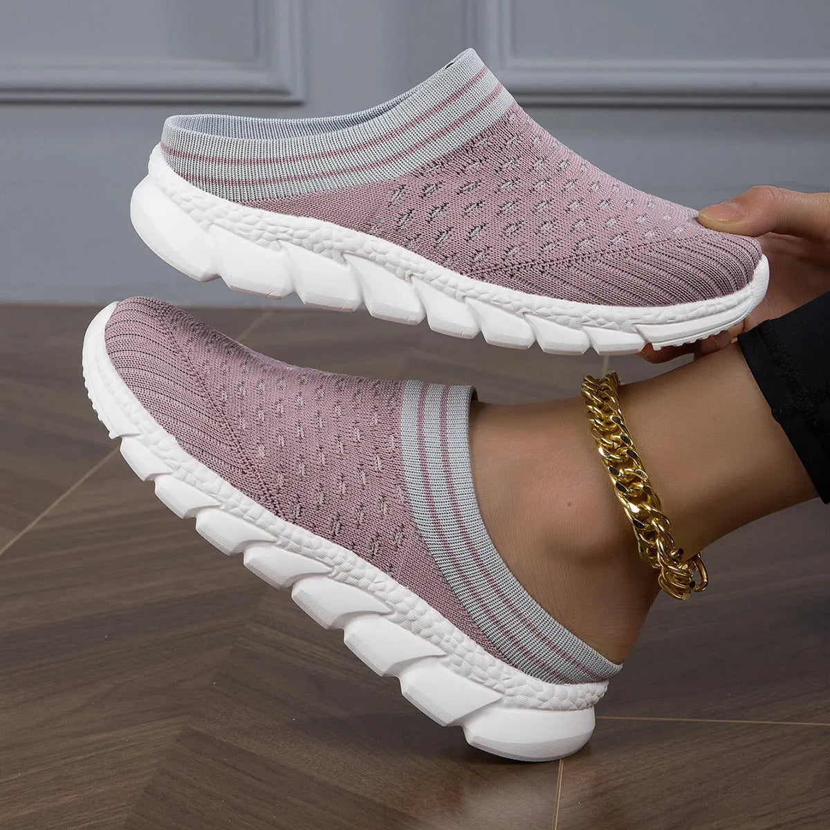 Women's Flyknit semi-slipper casual shoes in striped pattern with hollowed-out details, shown in black, pink, and purple.