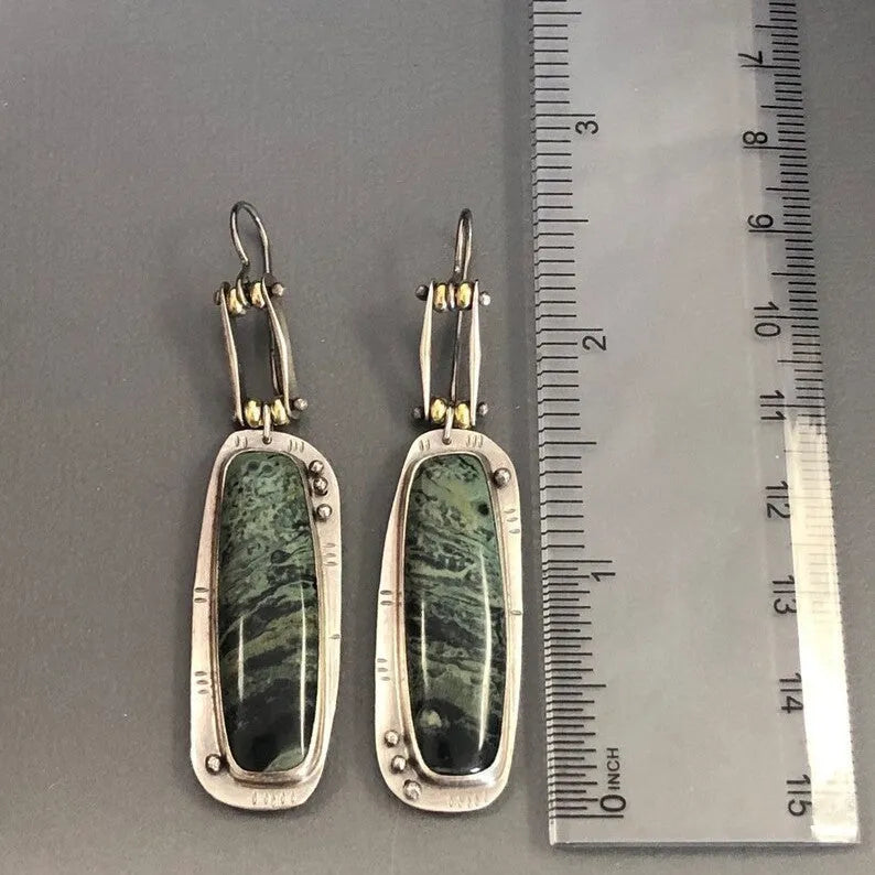 Geometric two-colour marble pattern alloy earrings with simple contemporary design