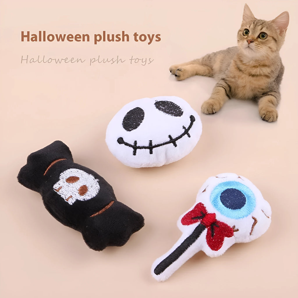 Small plush cat teaser wand with colourful eyes candy skull designs and feathers